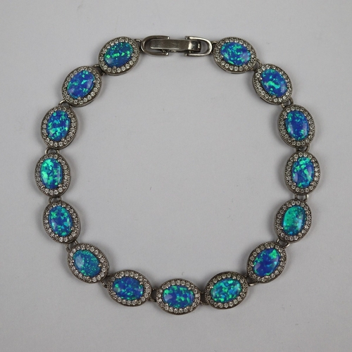 74 - A silver CZ and cultured opal bracelet