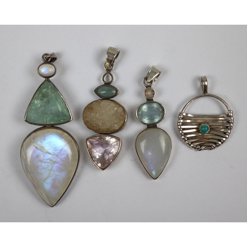 76 - 4 stone set silver pendants