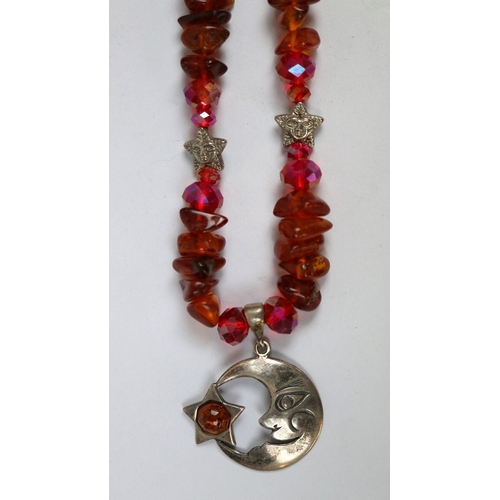 41 - Silver and amber moon pendant on amber necklace