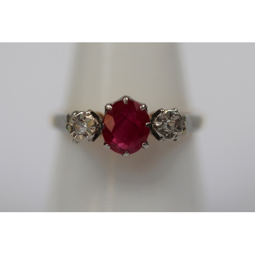 61 - 18ct gold diamond and ruby set ring - Size M