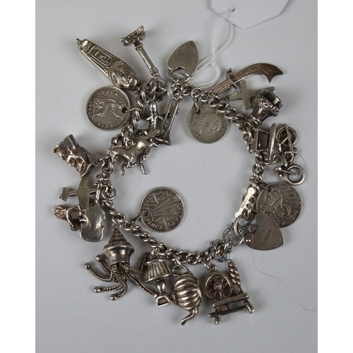 67 - Heavy silver charm bracelet