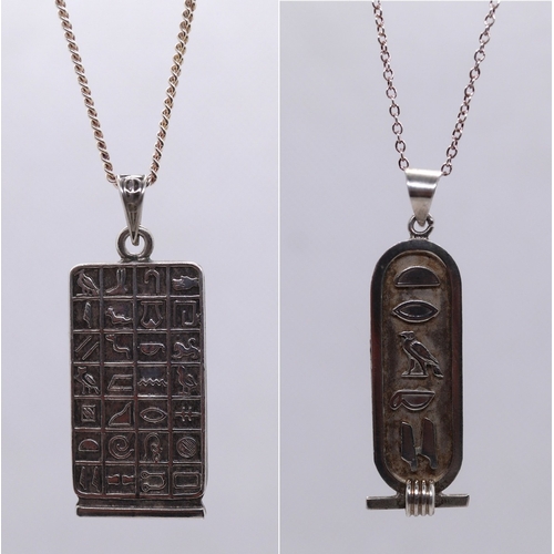 80 - 2 Egyptian style pendants on hallmarked silver chains