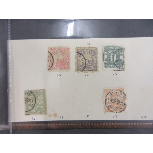 269 - Stamps - Japan earlies on parts of old album pages