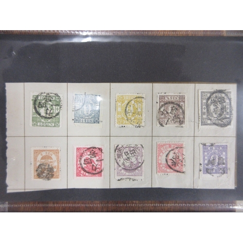 269 - Stamps - Japan earlies on parts of old album pages