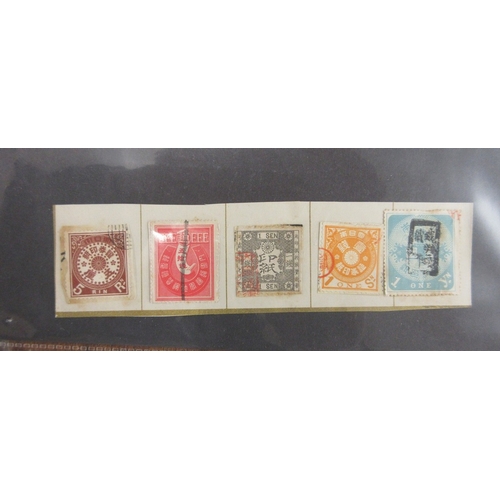 269 - Stamps - Japan earlies on parts of old album pages