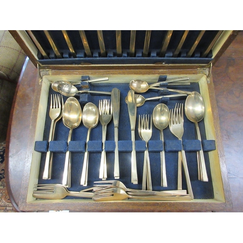 319 - Bronze canteen of cutlery