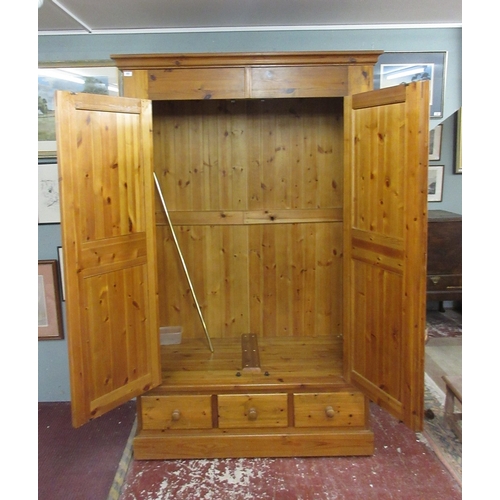 455 - Large pine wardrobe - W: 134cm D: 61cm H: 213cm