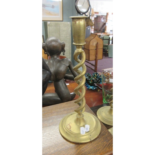 480 - Good collection of brass candlesticks together with a wrought iron candelabra