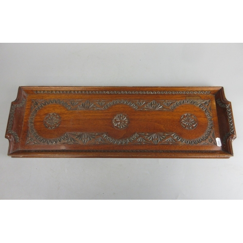 587 - Carved tray together with an oval copper tray