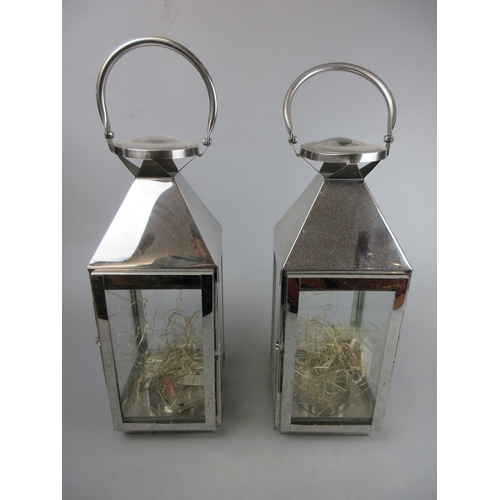 591 - Pair of lanterns together with a pair of decorative candelabra