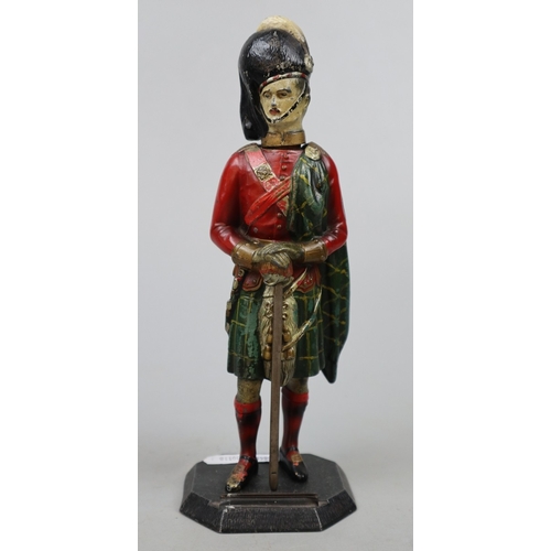 222 - Royal Scots Guard cast metal figural match striker/lighter together with a pair of WW1 French office... 