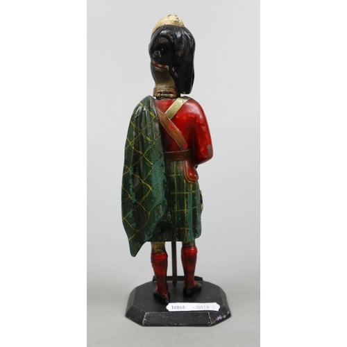 222 - Royal Scots Guard cast metal figural match striker/lighter together with a pair of WW1 French office... 