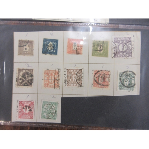 269 - Stamps - Japan earlies on parts of old album pages