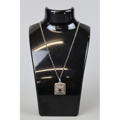 28 - Silver locket on chain set with onyx