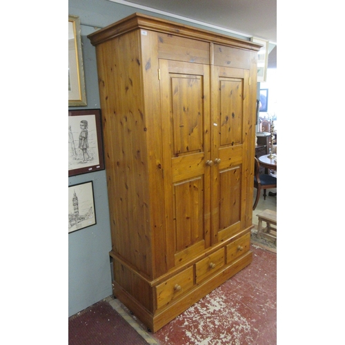 455 - Large pine wardrobe - W: 134cm D: 61cm H: 213cm