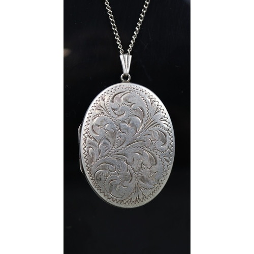 47 - Large silver locket on chain