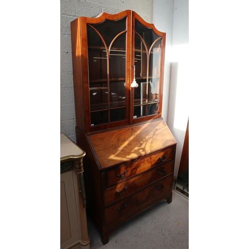 548 - Early 20th century walnut break front bookcase