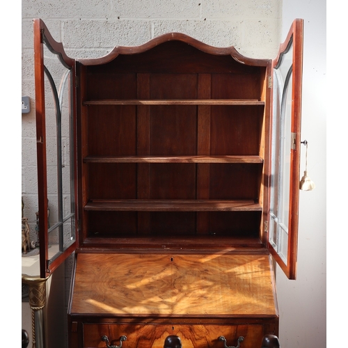 548 - Early 20th century walnut break front bookcase