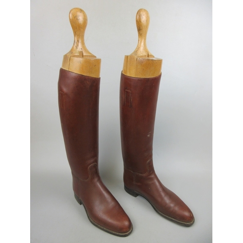 565 - Pair of riding boots with trees and boot remover