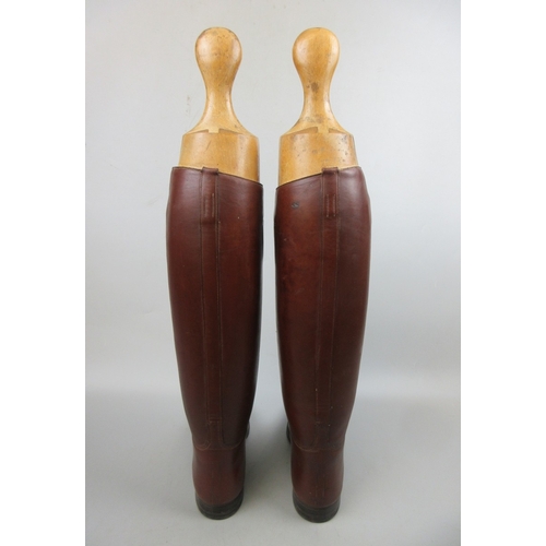 565 - Pair of riding boots with trees and boot remover