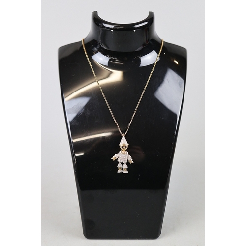 69 - 9ct gold articulated pendant set with diamonds on a 9ct gold chain