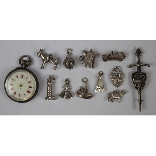 104 - 10 SILVER CHARMS, an Edwardian silver backed ladies fob watch nicely engraved c. 1910 and a SILVER d... 