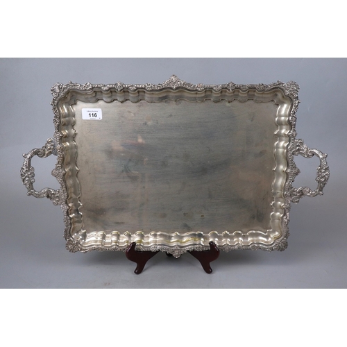 116 - Large mid 20c silver plated heavy tray 46cms x 35. Gadrooned edges and heavily decorated with two ha... 