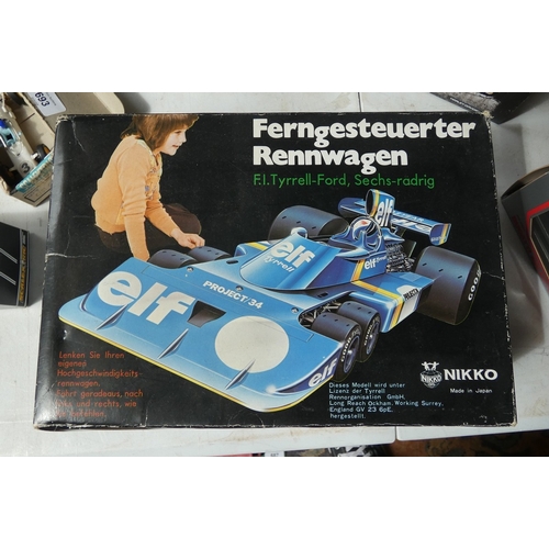 Tyrell 6 wheeled ELF F1 R/C racing car together with a boxed 1:24 die ...