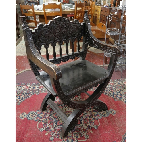 477 - Antique carved X chair