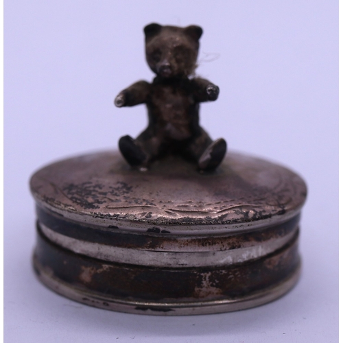 60 - Antique silver pot plus contemporary silver pill box topped with a teddy bear