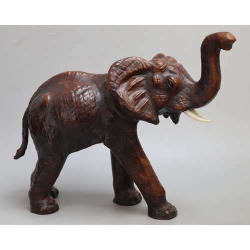 144 - Liberty's style leather 'fireside animals' elephant.  Mid 20th Century, good leather-bound condition...