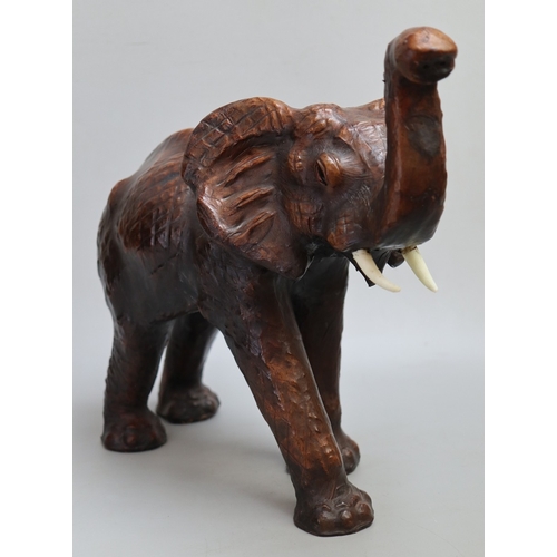 144 - Liberty's style leather 'fireside animals' elephant.  Mid 20th Century, good leather-bound condition... 