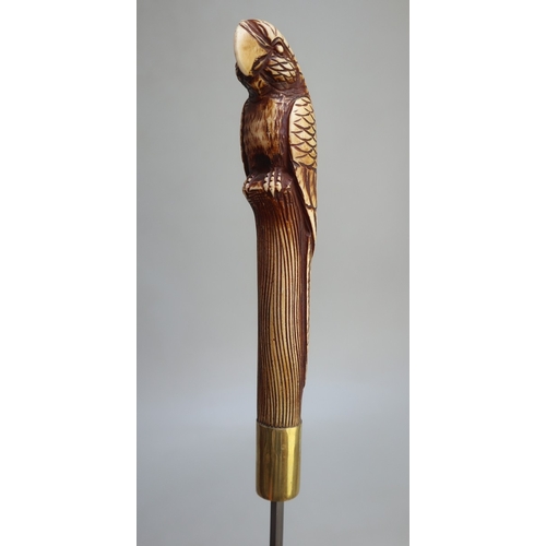 317 - Bamboo cane swordstick, with brass collar and ferrule and 'parrot' design handle