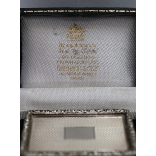 42 - A fine Garrard & Co silver presentation small casket. The heavy box has a cast border with vacan... 