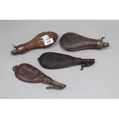 178 - A collection of military powder flasks