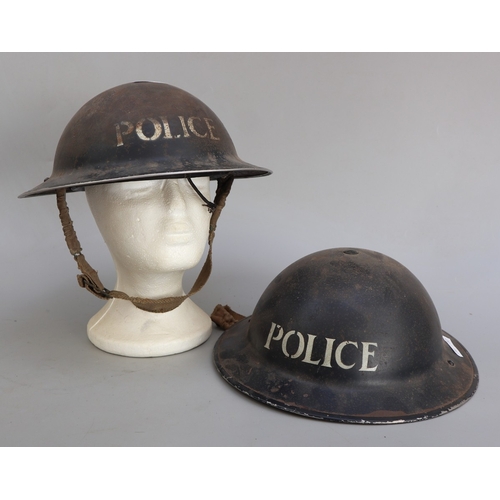 306 - 2 military police helmets