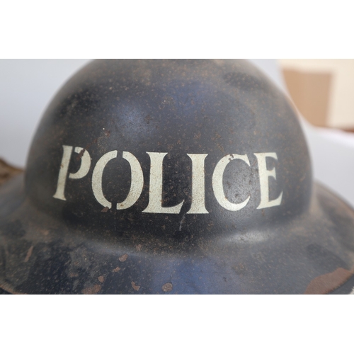 306 - 2 military police helmets