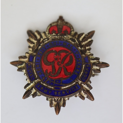 34 - Collection of military badges, gun pull through etc