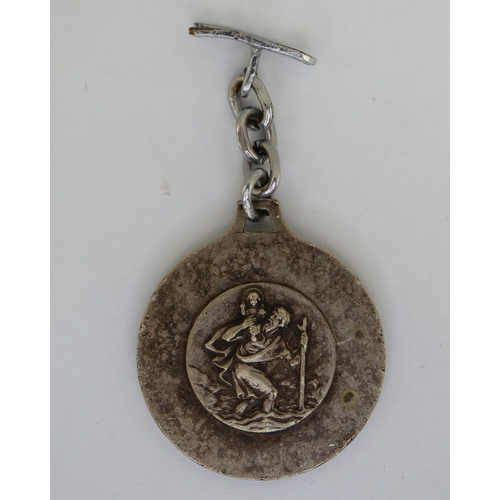 34 - Collection of military badges, gun pull through etc