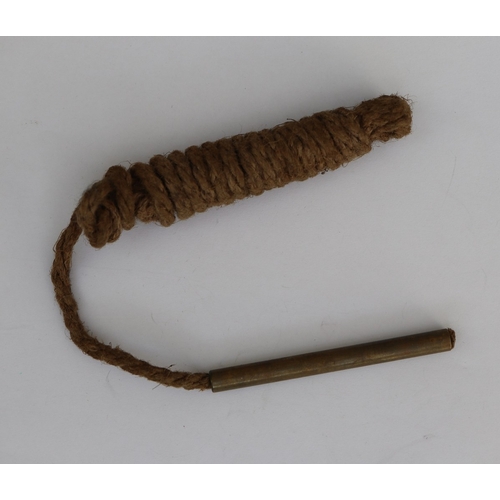 34 - Collection of military badges, gun pull through etc