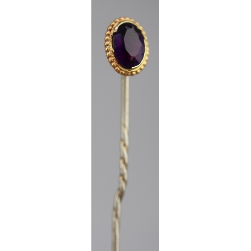 Gold mounted amethyst tie pin