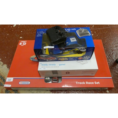 2 track race sets together with a remote control Subaru