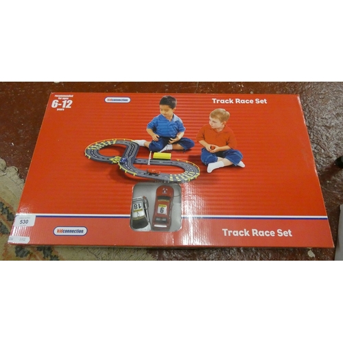 2 track race sets together with a remote control Subaru