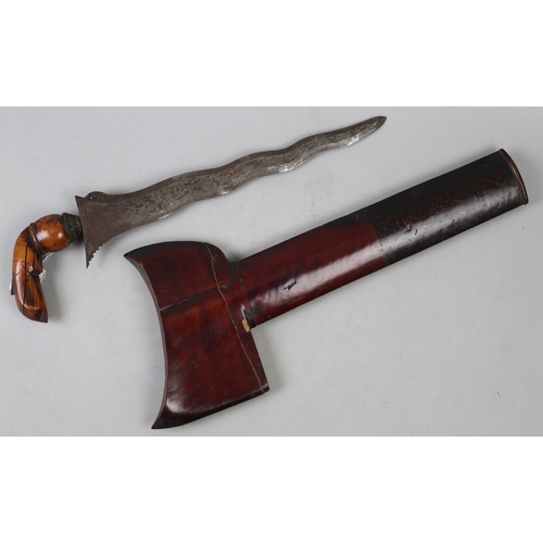 207 - A Javanese Keris (Kris), Indonesia, 19th Century A traditional Javanese keris (kris) with wavy blade... 