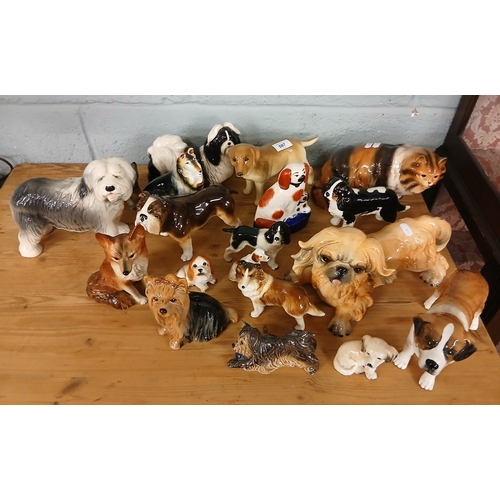 597 - Large collection of ceramic dog figures to include Beswick and Goebel