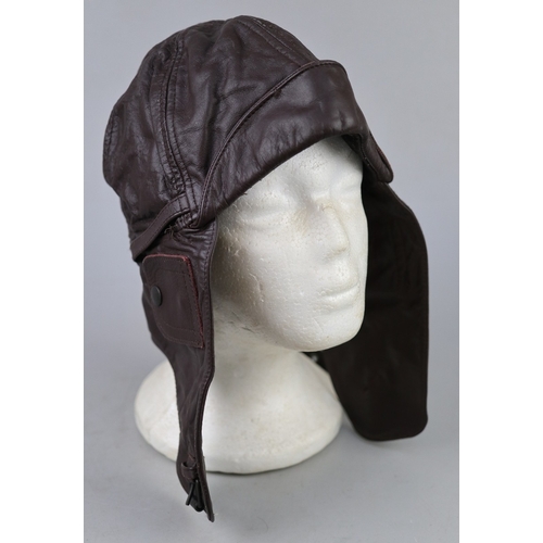 156 - Vintage flying cap together with a clock