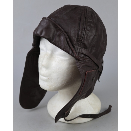 156 - Vintage flying cap together with a clock