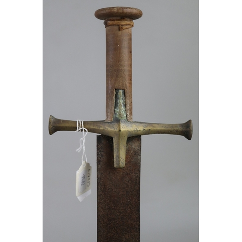 209 - Islamic broad sword with brass cross guard and wooden handle