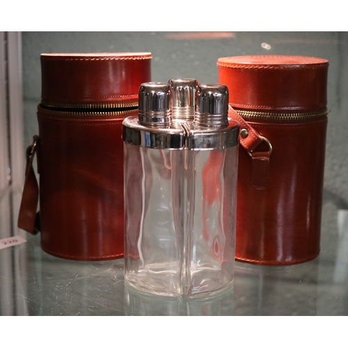 220 - Pair of field sports triple flasks in leather carrying cases