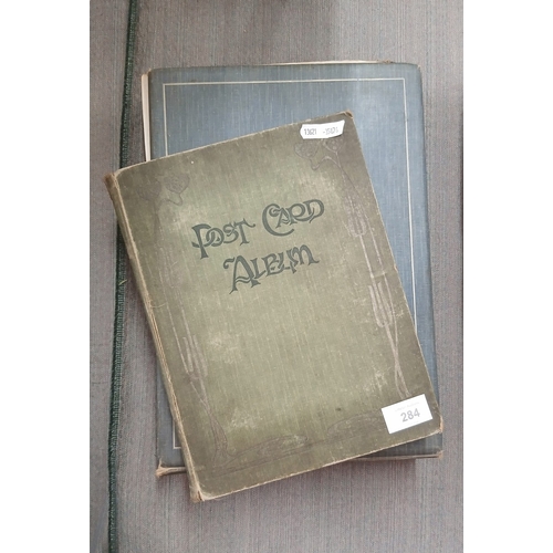 284 - 2 albums of postcards